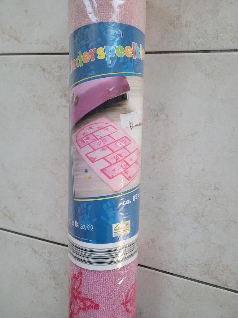 Tapijt hinkelpad roze, Ophalen