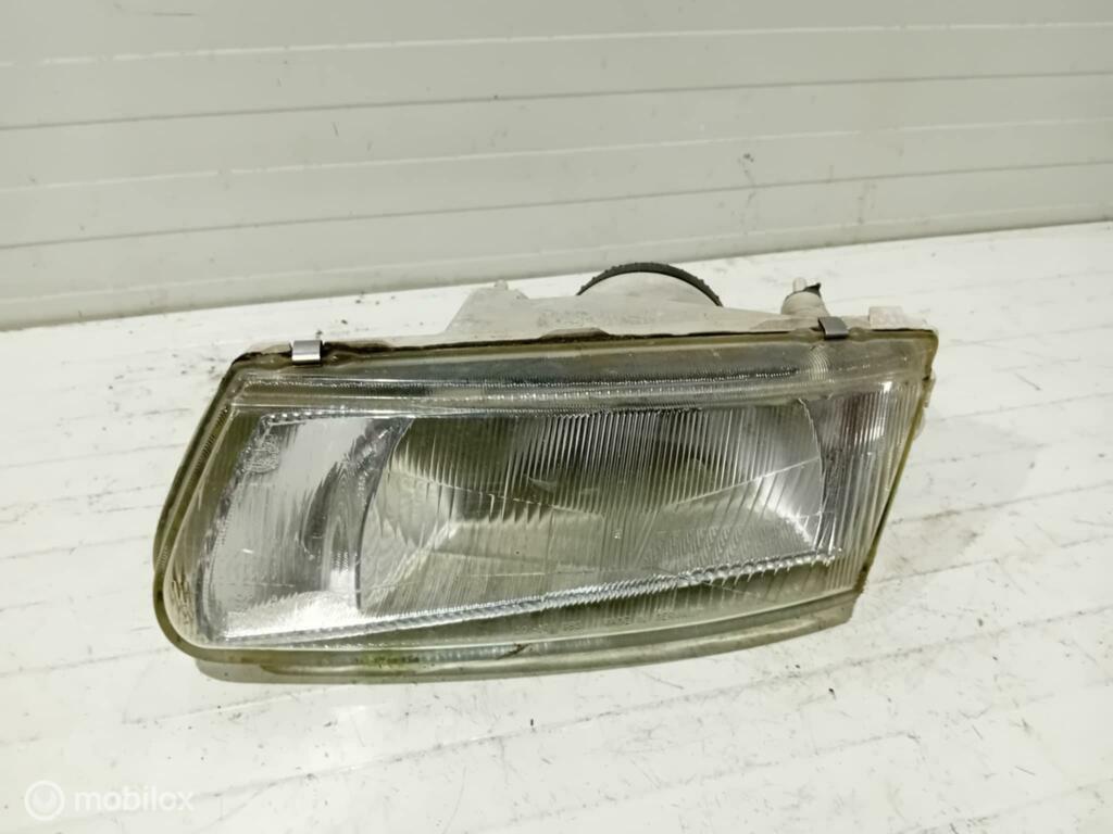 Koplamp Mitsubishi Carisma 14525900, Gebruikt, Ophalen of Verzenden