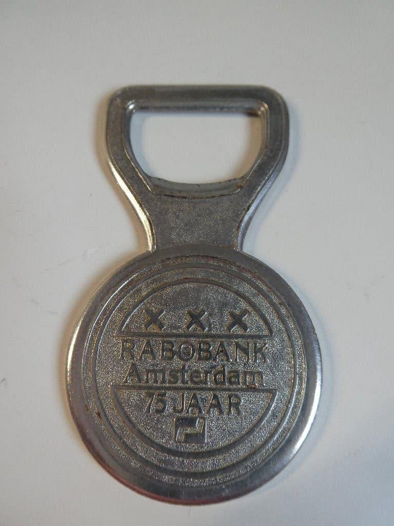Rabobank Amsterdam 75 jaar flessen opener, Ophalen of Verzenden, Gebruikt, Gebruiksvoorwerp