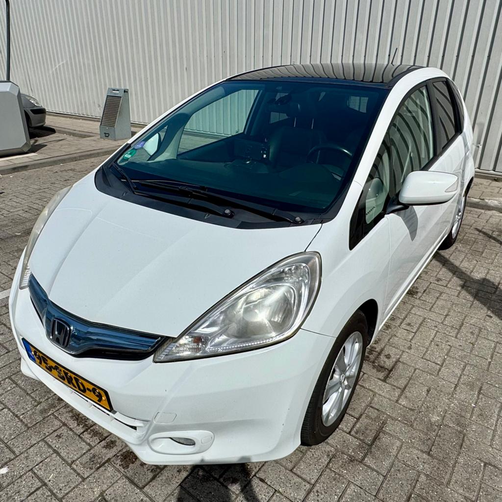 Honda Jazz HYBRID Exclusive | pano | leder | trekh | 1e eig, Auto's, Honda, Zwart, 4 cilinders, Navigatiesysteem, 1000 kg