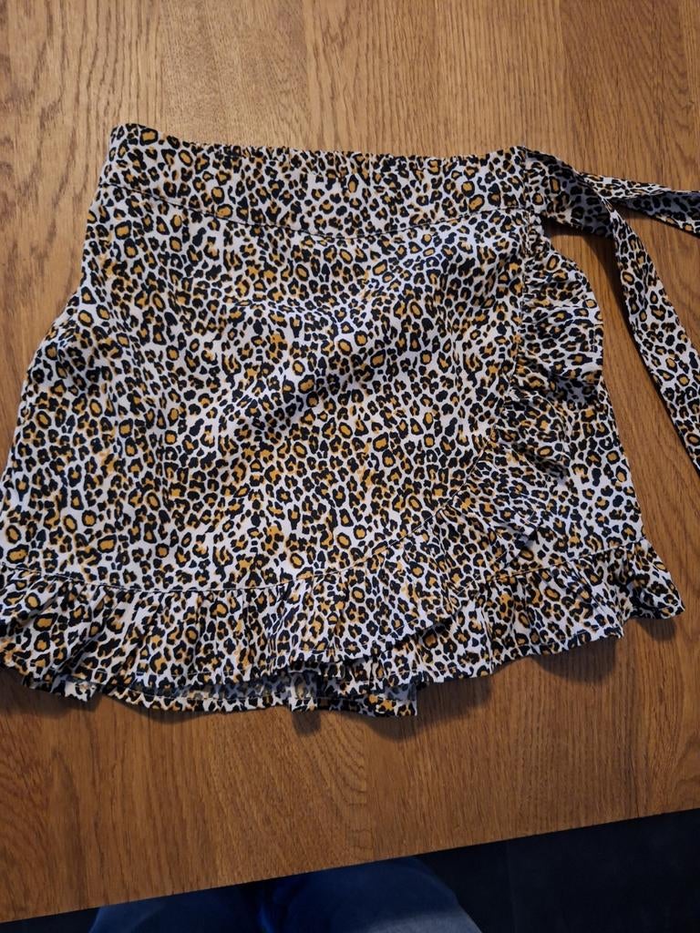 Panter rokje maat 140, Kleding | Dames, Rokken, Ophalen of Verzenden, Zo goed als nieuw, Zwart, Boven de knie