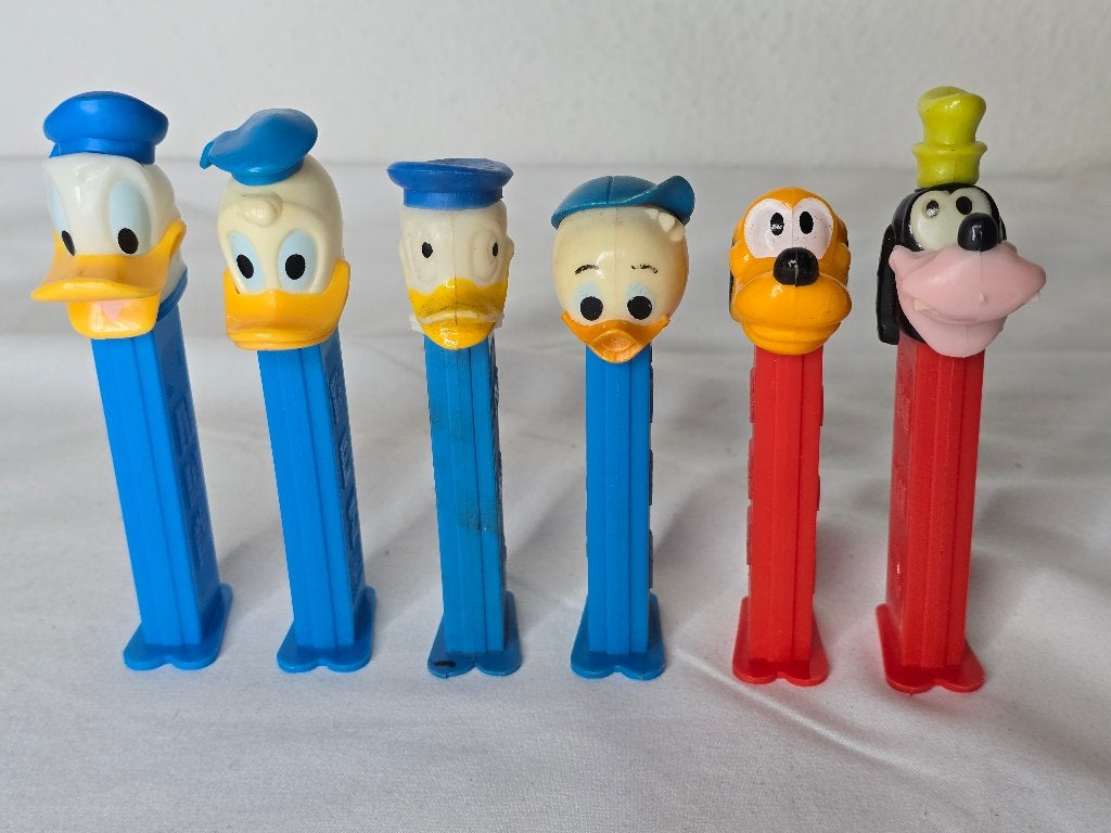 Disney 7x PEZ dispenser Donald Duck, Pluto en Goofy vintage, Ophalen of Verzenden, Donald Duck, Gebruikt, Beeldje of Figuurtje