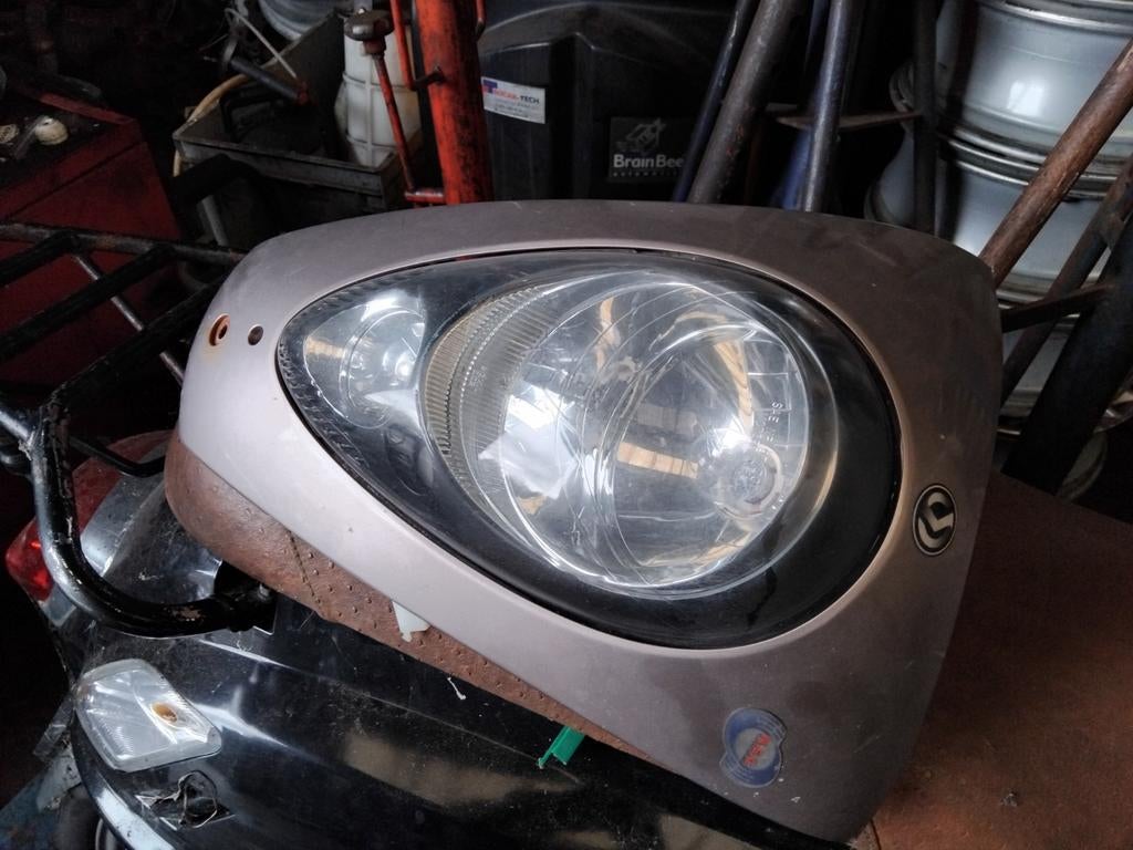 Voorkap + koplamp sym mio, Ophalen of Verzenden, Gebruikt, Koplamp