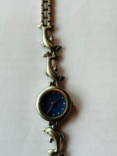 dames kinderhorloge met band van dolfijnen, Sieraden, Tassen en Uiterlijk, Horloges | Dames, Overige merken, Staal, Staal, Ophalen of Verzenden