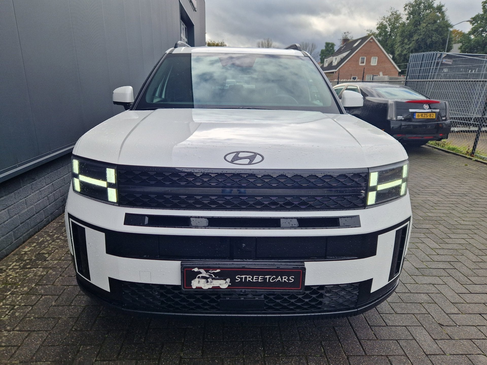 Hyundai Santa Fe 1.6 T-GDI PHEV Black Line 4WD 7p, Auto's, Automaat, Santa Fe, Zwart, 4 cilinders