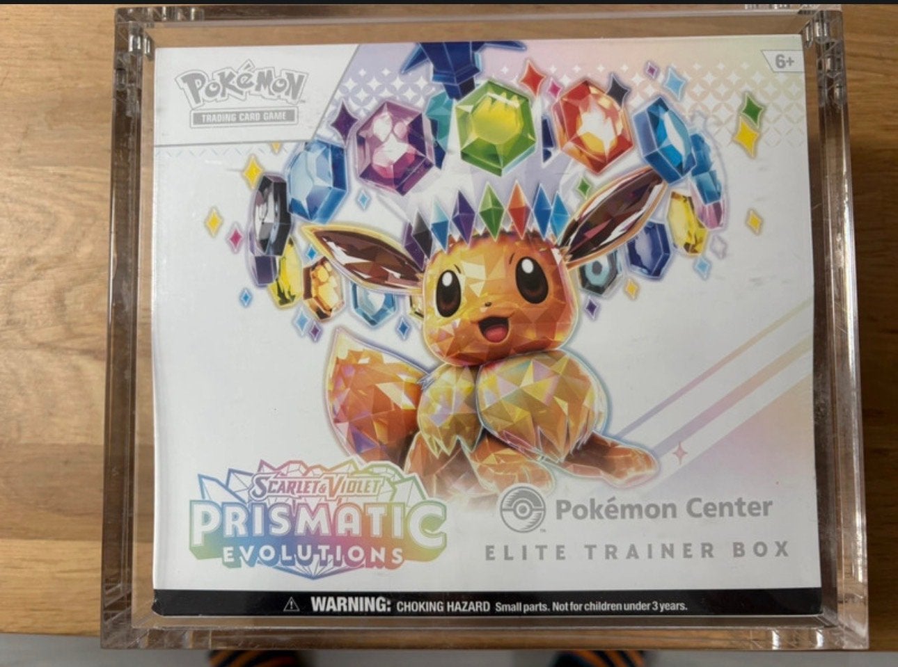 Prismatic Evolutions Pokémon Center Elite Trainer Box, Hobby en Vrije tijd, Ophalen of Verzenden, Nieuw, Overige typen, Foil