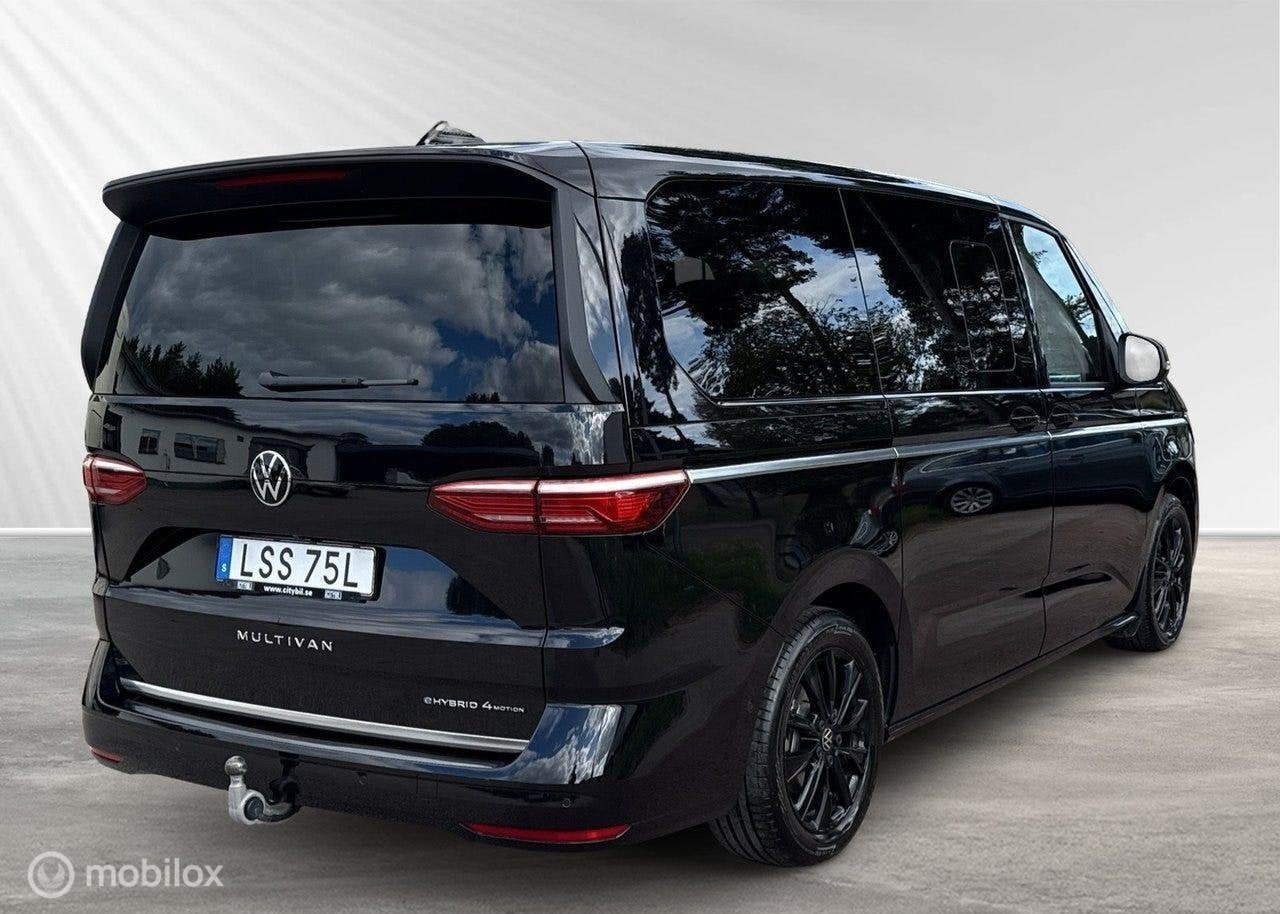 Volkswagen Multivan 1.5 eHybrid L2 4M Good Night Package, Auto's, Volkswagen, Automaat, 7 stoelen, Zwart, Bedrijf