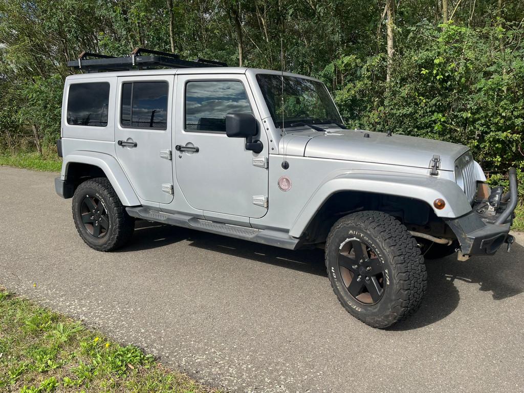 Jeep Wrangler Unlimited 2.8 CRD Sahara Nieuwe APK Dakar edit, Auto's, Jeep, Automaat, Euro 5, Gebruikt, Zwart