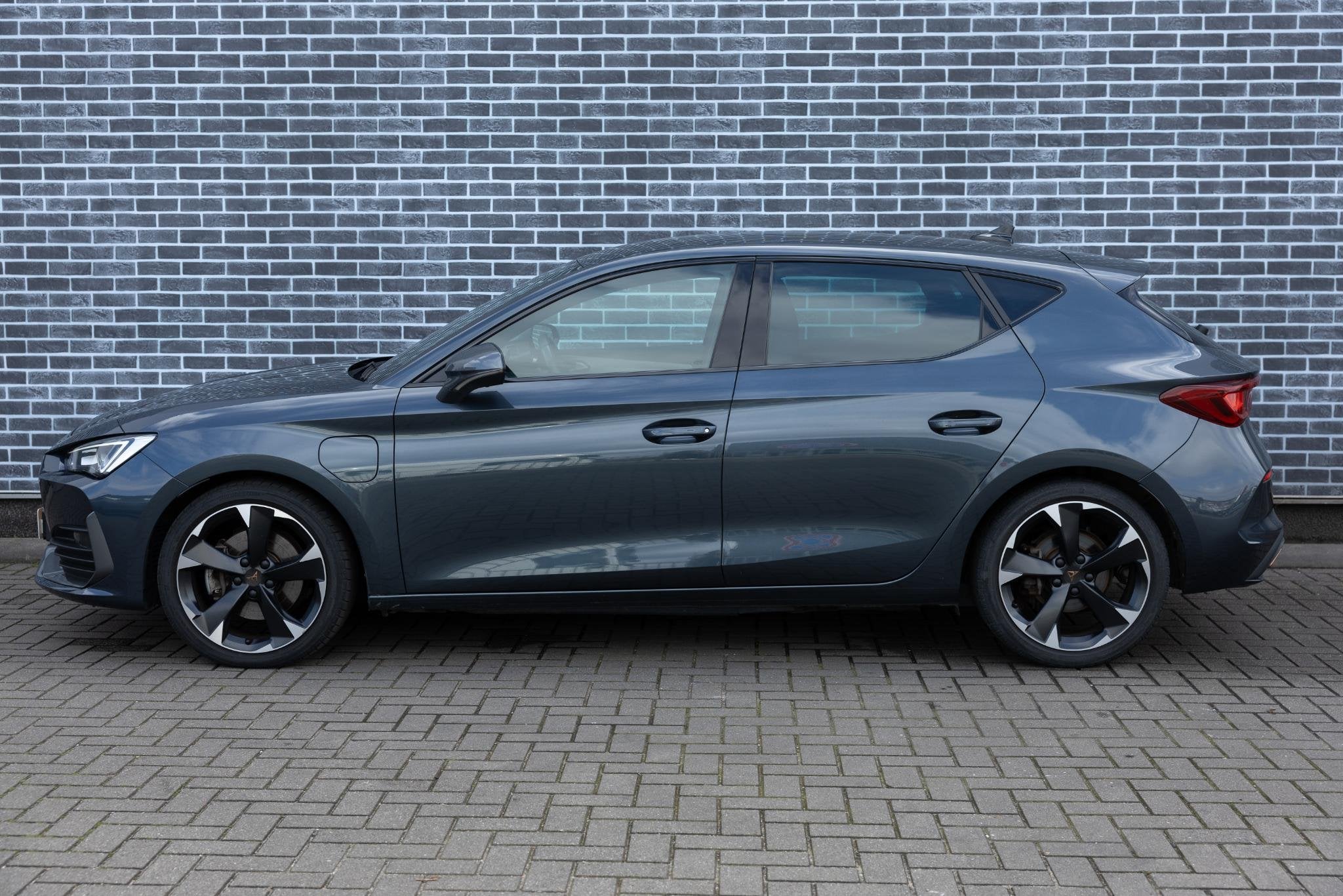 Cupra Leon 1.4 e-Hybrid Business | Cruise Control Adaptief |, Auto's, Stof, Gebruikt, 4 cilinders, 150 pk
