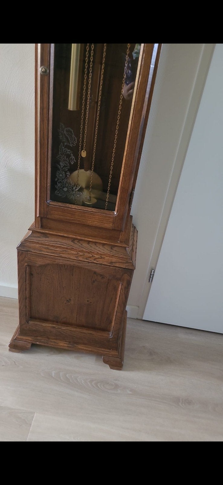 Klassieke staande klok van eikenhout, Ophalen