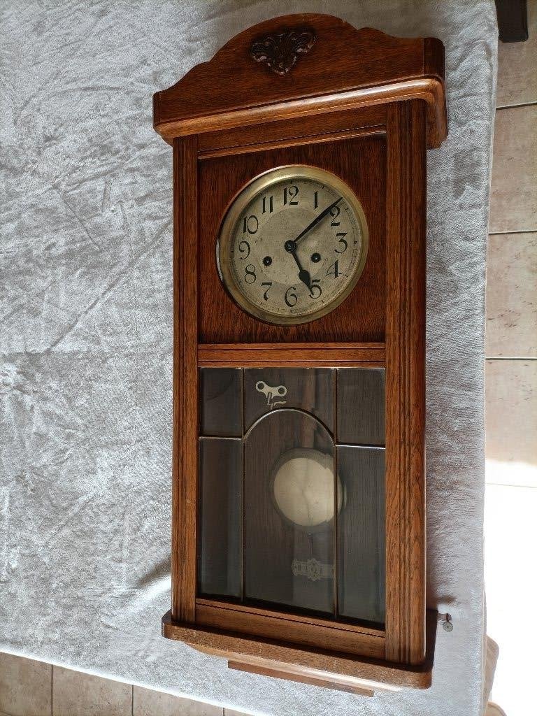 Antieke bak regulator klok, Ophalen