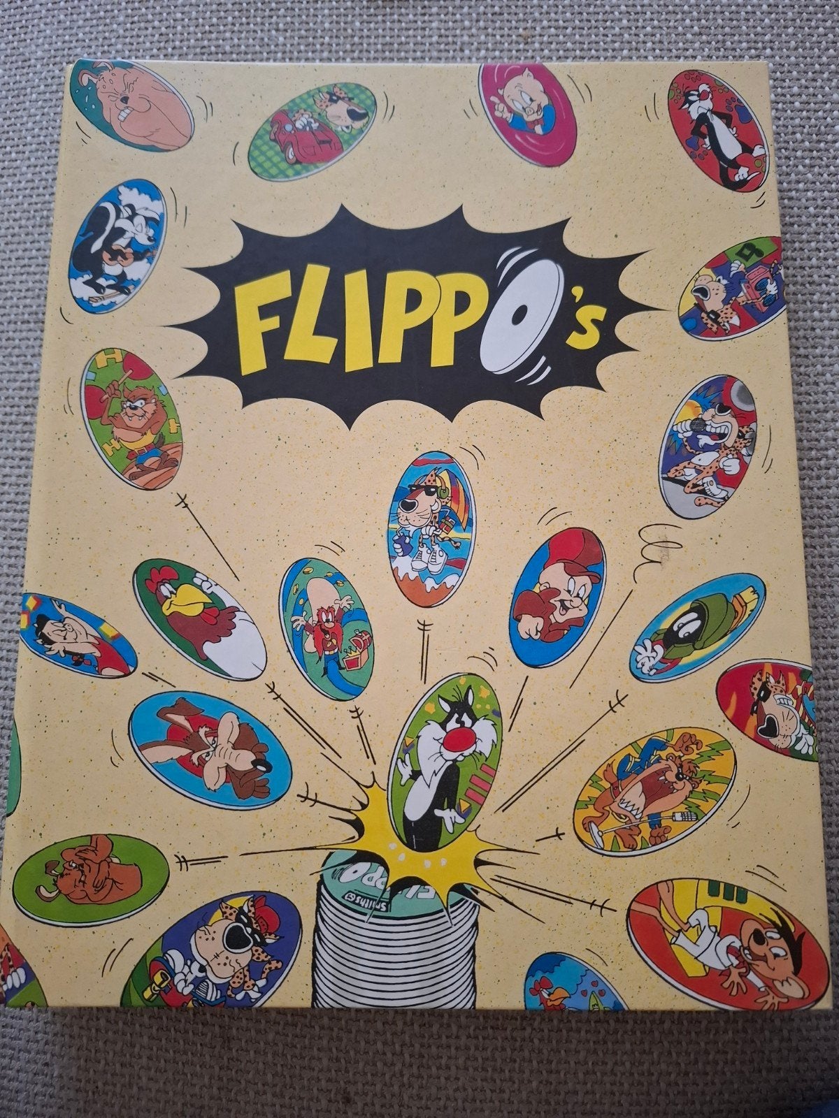 map met flippo's. Niet helemaal compleet, Verzamelen, Ophalen of Verzenden, Looney Tunes, Verzameling, Met verzamelmap(pen)