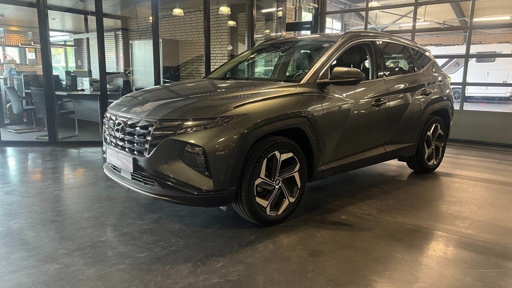 Hyundai TUCSON 1.6 T-GDI HEV Premium 230 Pk Automaat 1650 kg, Auto's, Gebruikt, Huisgarantie, 4 cilinders, Met garantie (alle)