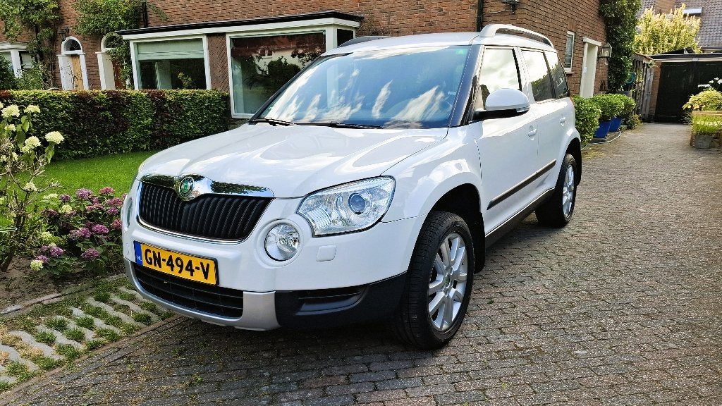 Skoda Yeti 1.2TSI Ambiance 77KW 2011 Wit, Auto's, Skoda, Voorwielaandrijving, Beige, 4 cilinders, Alcantara
