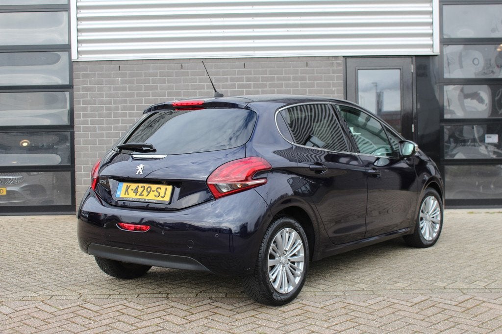 Peugeot 208 1.2 PureTech Allure / Camera / Navigatie / Autom, Gebruikt, 1199 cc, Met garantie (alle), Blauw