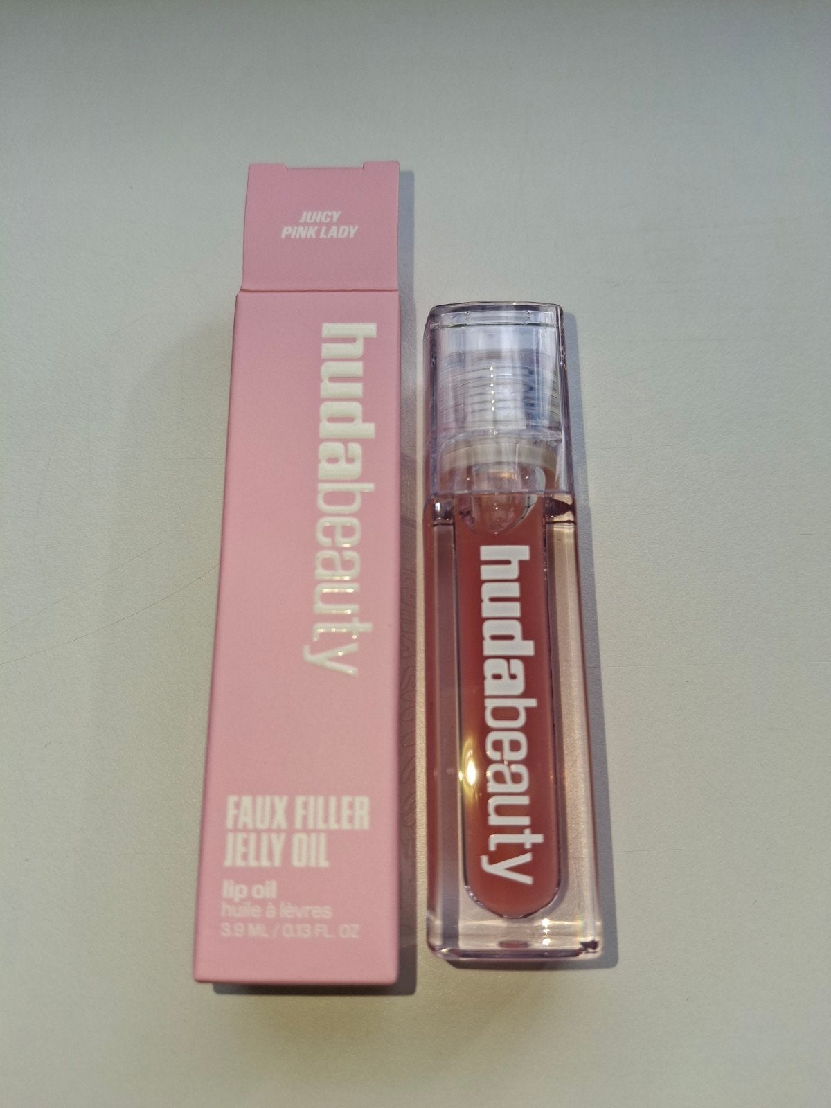 Huda beauty Faux filler lip oil, Ophalen of Verzenden, Nieuw, Roze, Lippen