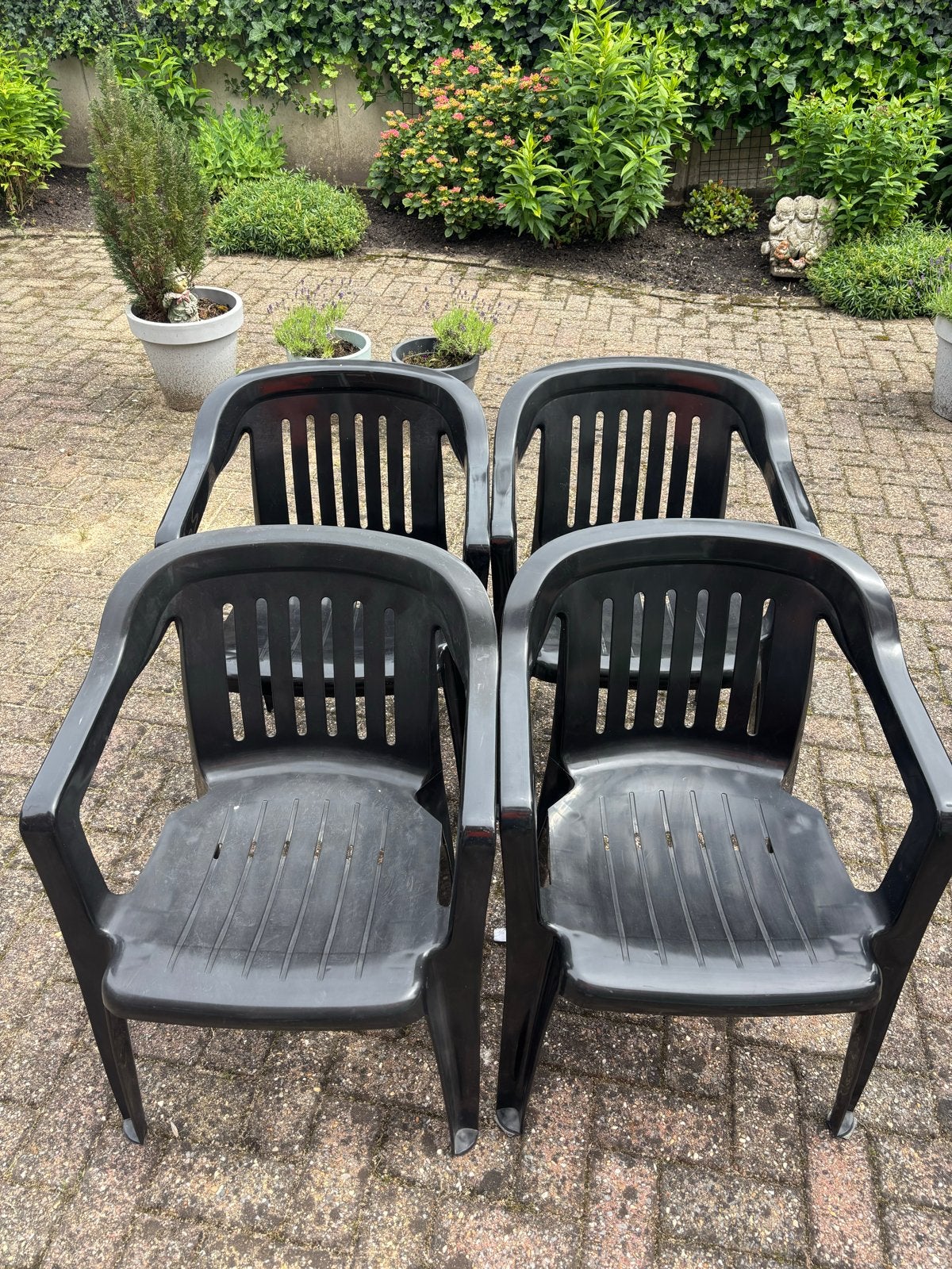 4 zwarte tuinstoelen van kunststof, Ophalen, Gebruikt, Kunststof, Stapelbaar