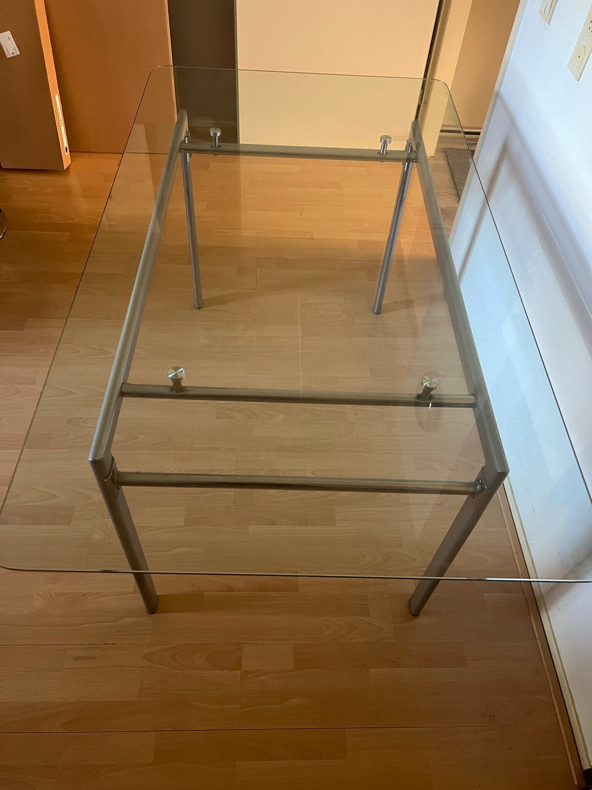 Glazen eettafel met metalen onderstel, Ophalen, Gebruikt, 100 tot 150 cm, 50 tot 100 cm