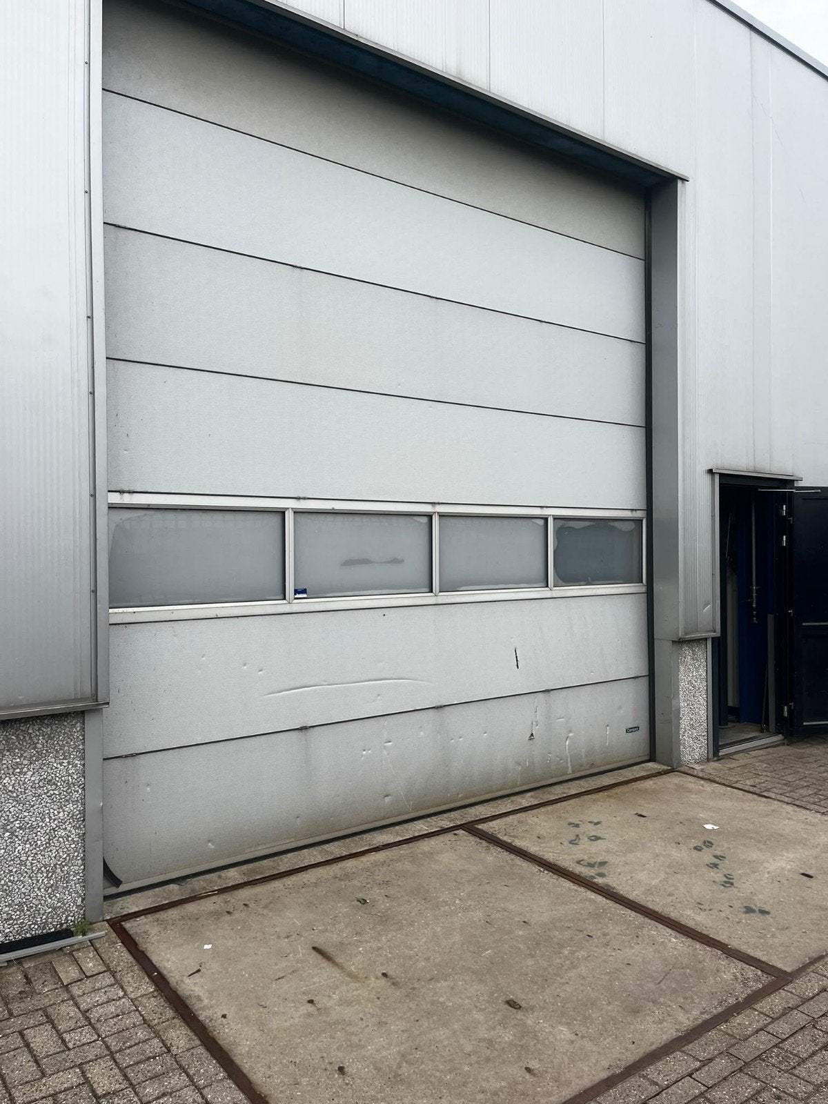 Compact garagedeur te koop in Vierpolders, Garagedeur, Ophalen of Verzenden, Vouwdeur, Kunststof