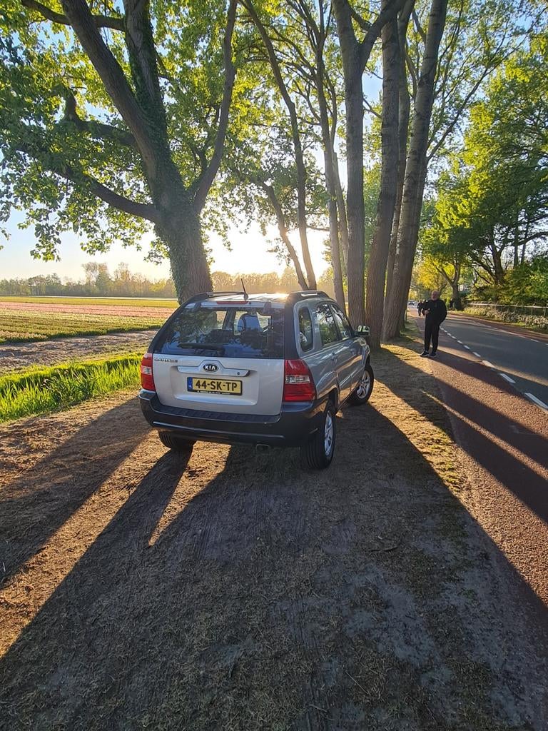 Kia Sportage 2.0 2WD 2006 Grijs, Auto's, Kia, 1442 kg, Zwart, 4 cilinders, Leder en Stof