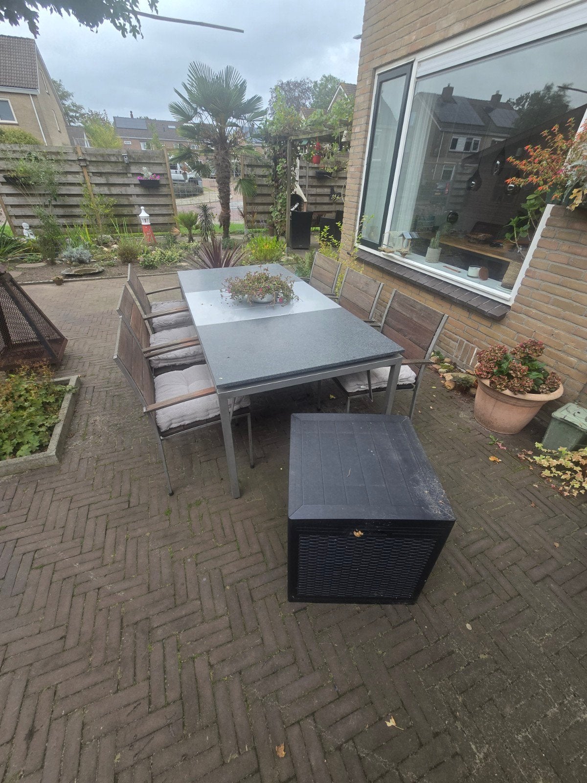 PalmCollect tuinset met 6 stoelen en granieten tafel, Tuin en Terras, Ophalen, 6 zitplaatsen, Zo goed als nieuw, Rvs