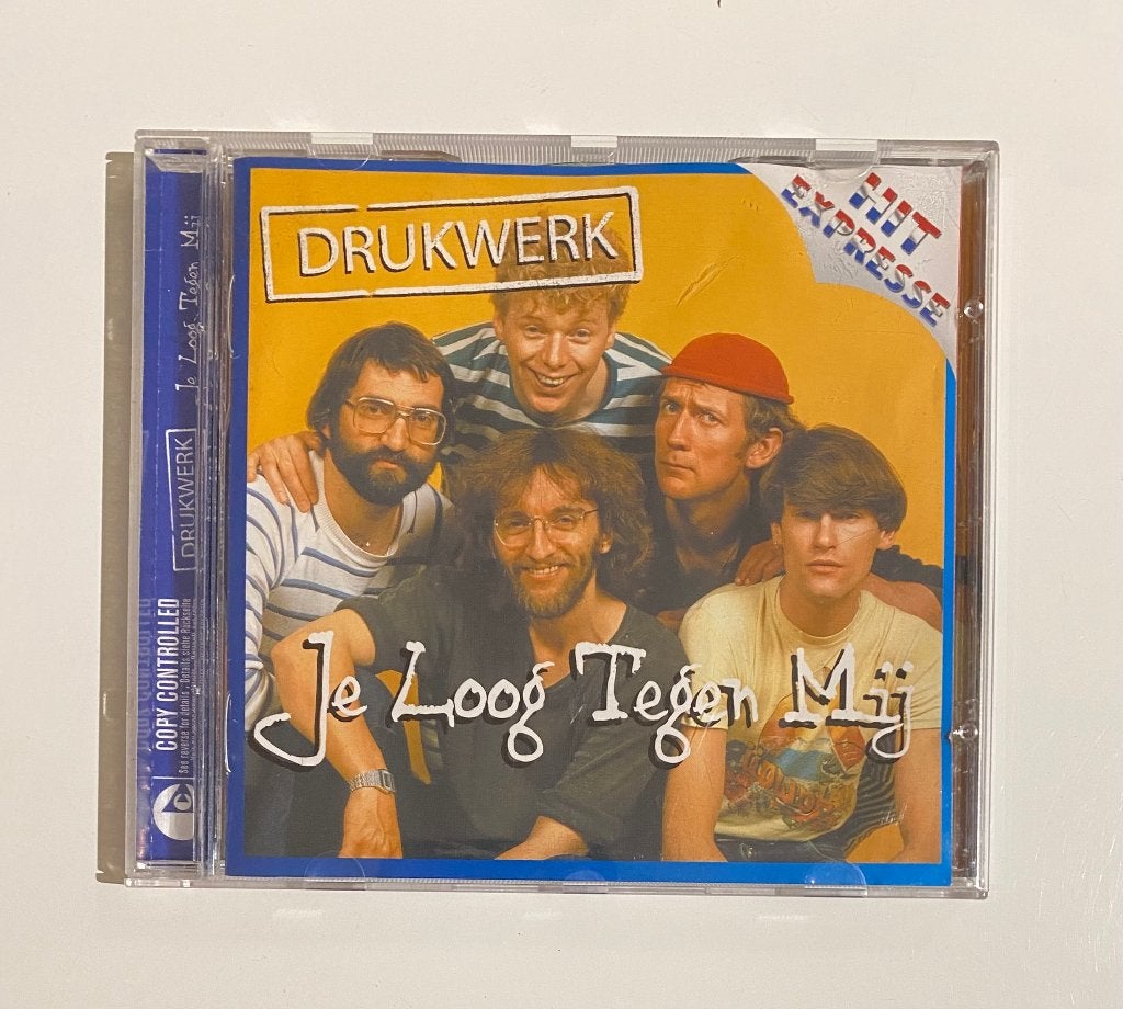 Drukwerk - Je Loog Tegen Mij 2003 Benelux - VG+/VG+, Inclusief boekje, Ophalen of Verzenden, Zo goed als nieuw, Levenslied of Smartlap