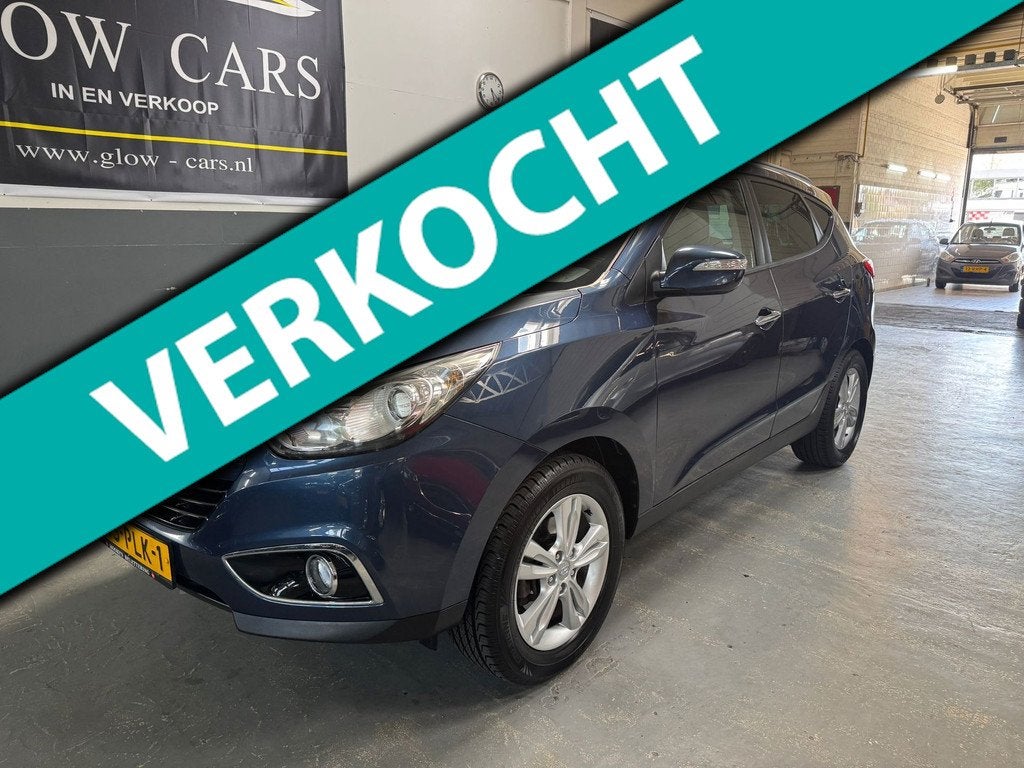 Hyundai Ix35 2.0i Style AIRCO|CRUISE|PDC|TREKHAAK|BLUETOOTH|, Auto's, Hyundai, Zwart, 4 cilinders, Blauw, Leder en Stof