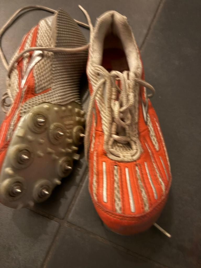 Oranje hardloopschoenen met spikes, Overige merken, Gebruikt, Ophalen of Verzenden, Spikes