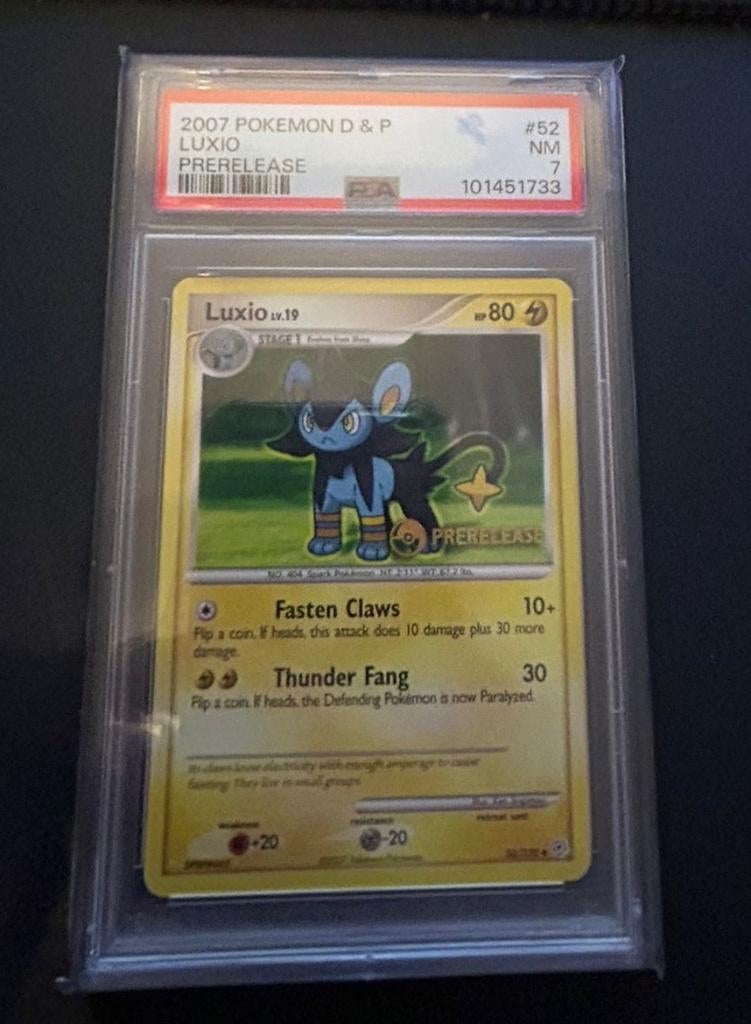 Luxio #52 PSA 7, Ophalen of Verzenden, Nieuw, Losse kaart, Foil