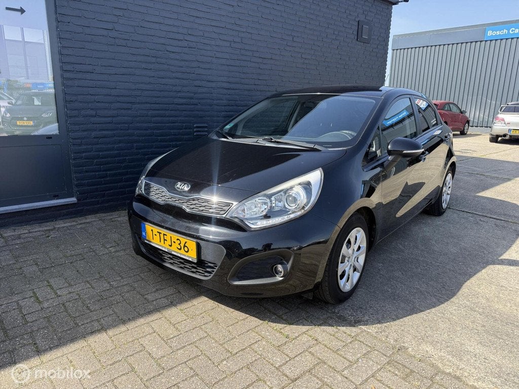 Kia Rio 1.2 CVVT ComfortLine, Auto's, Huisgarantie, 4 cilinders, Met garantie (alle), Zwart