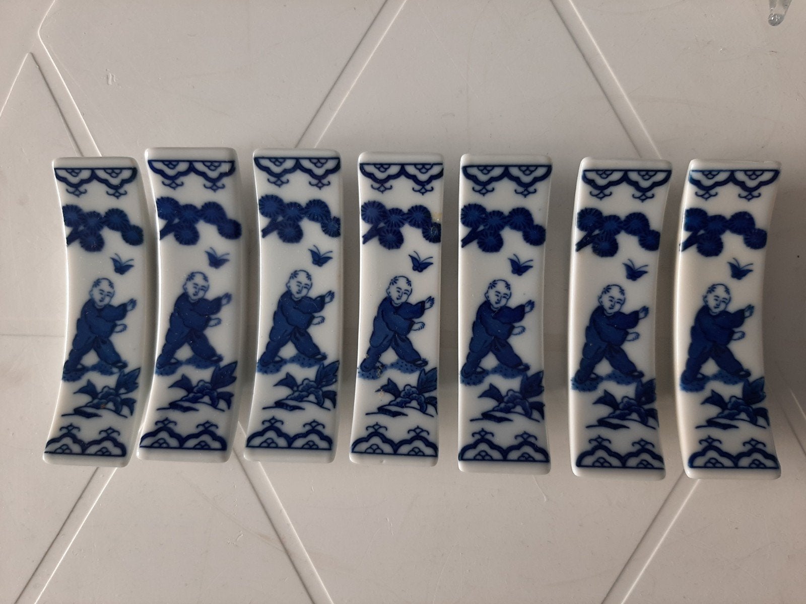Set van 7 blauw-witte porseleinen messenleggers, Ophalen of Verzenden