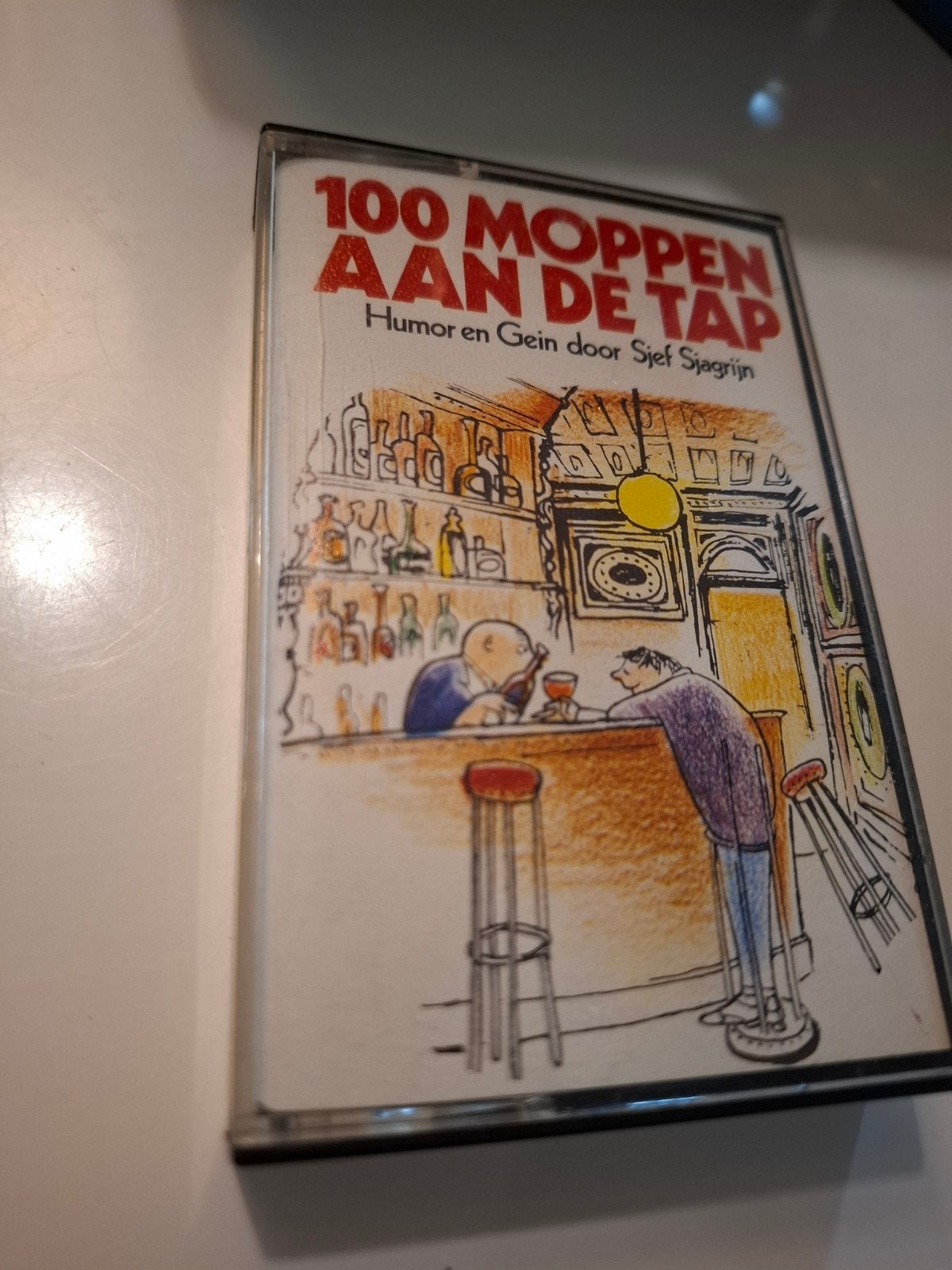 100 Moppen aan de Tap - Humor en Gein door Sjef Sjagrijn, Gebruikt, 1 bandje, Ophalen of Verzenden, Voorbespeeld