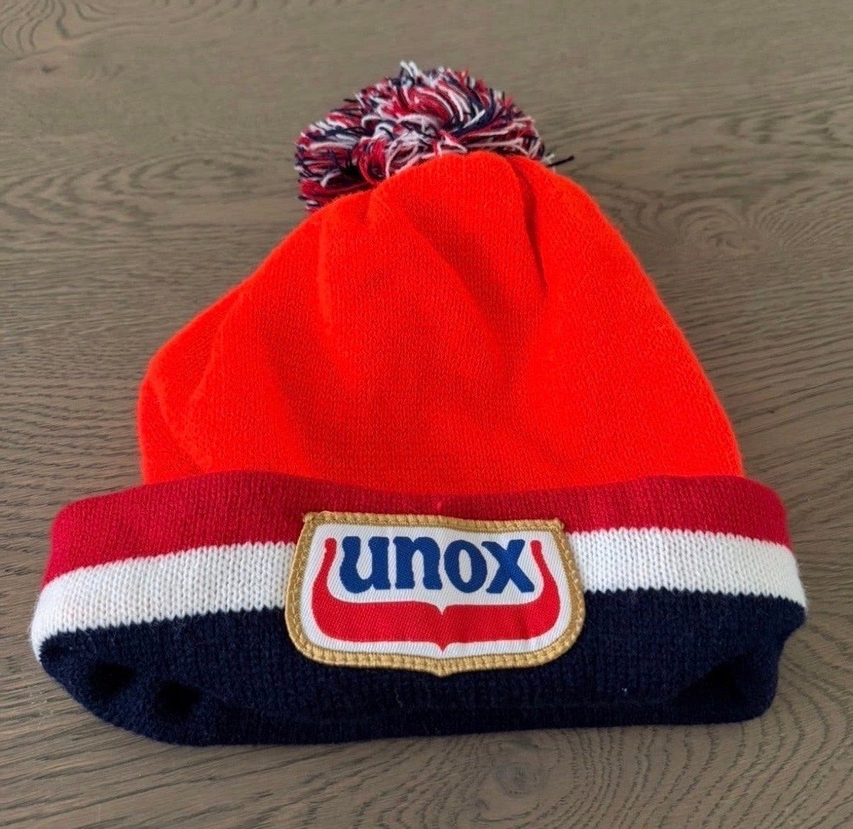 Unox Muts met Pompon - Oranje, Blauw, Wit, Ophalen of Verzenden, Nieuw, Maat 38/40 (M), Muts