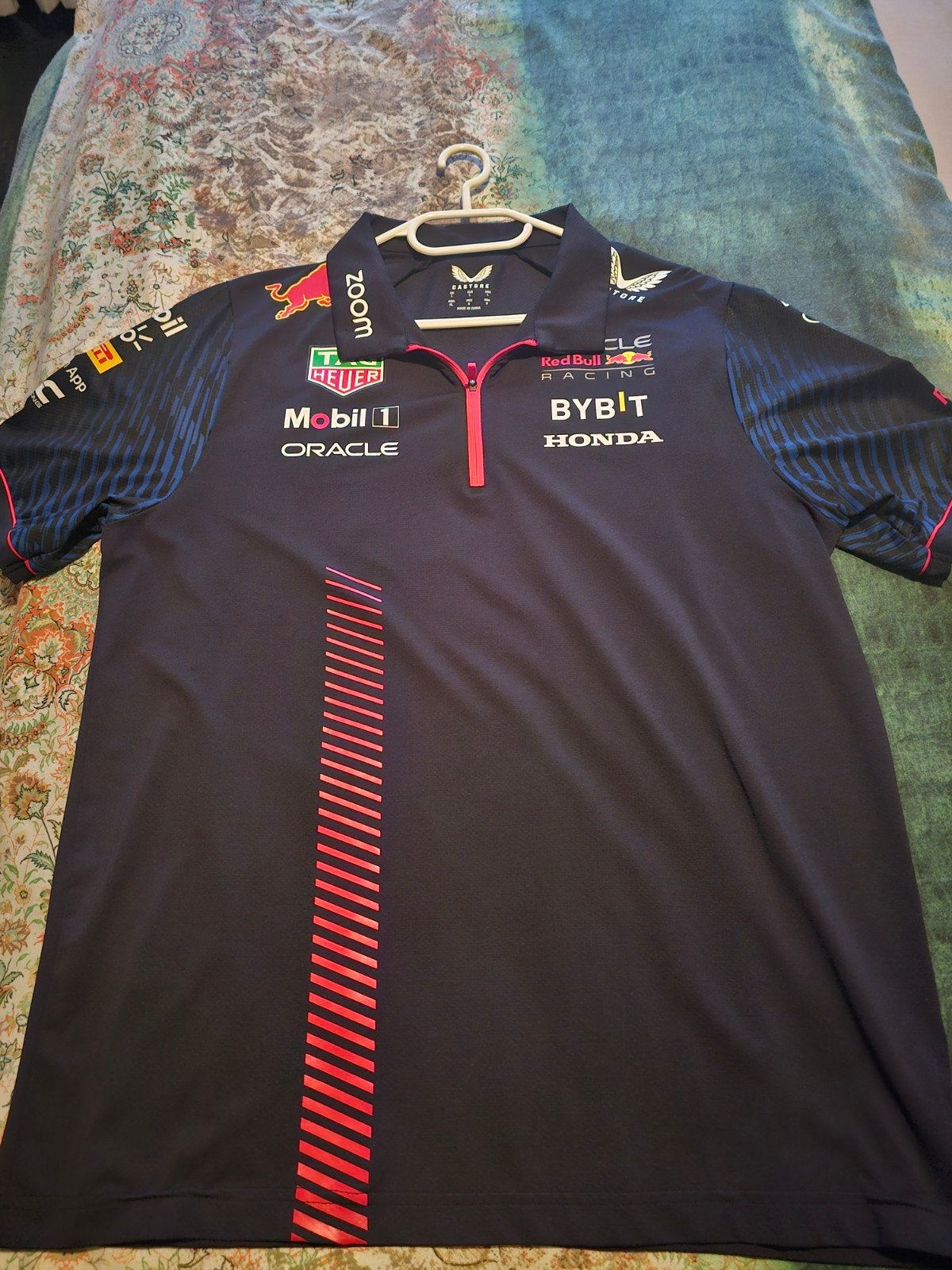Red Bull F1 Polo Castore Maat L, Ophalen of Verzenden, Zo goed als nieuw, Castore