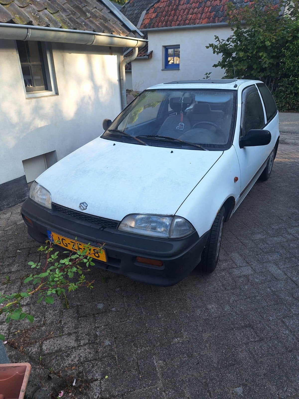 Suzuki Swift 1.0 Spirit U9 1994 Wit, Auto's, Suzuki, Voorwielaandrijving, Origineel Nederlands, Handgeschakeld, Grijs