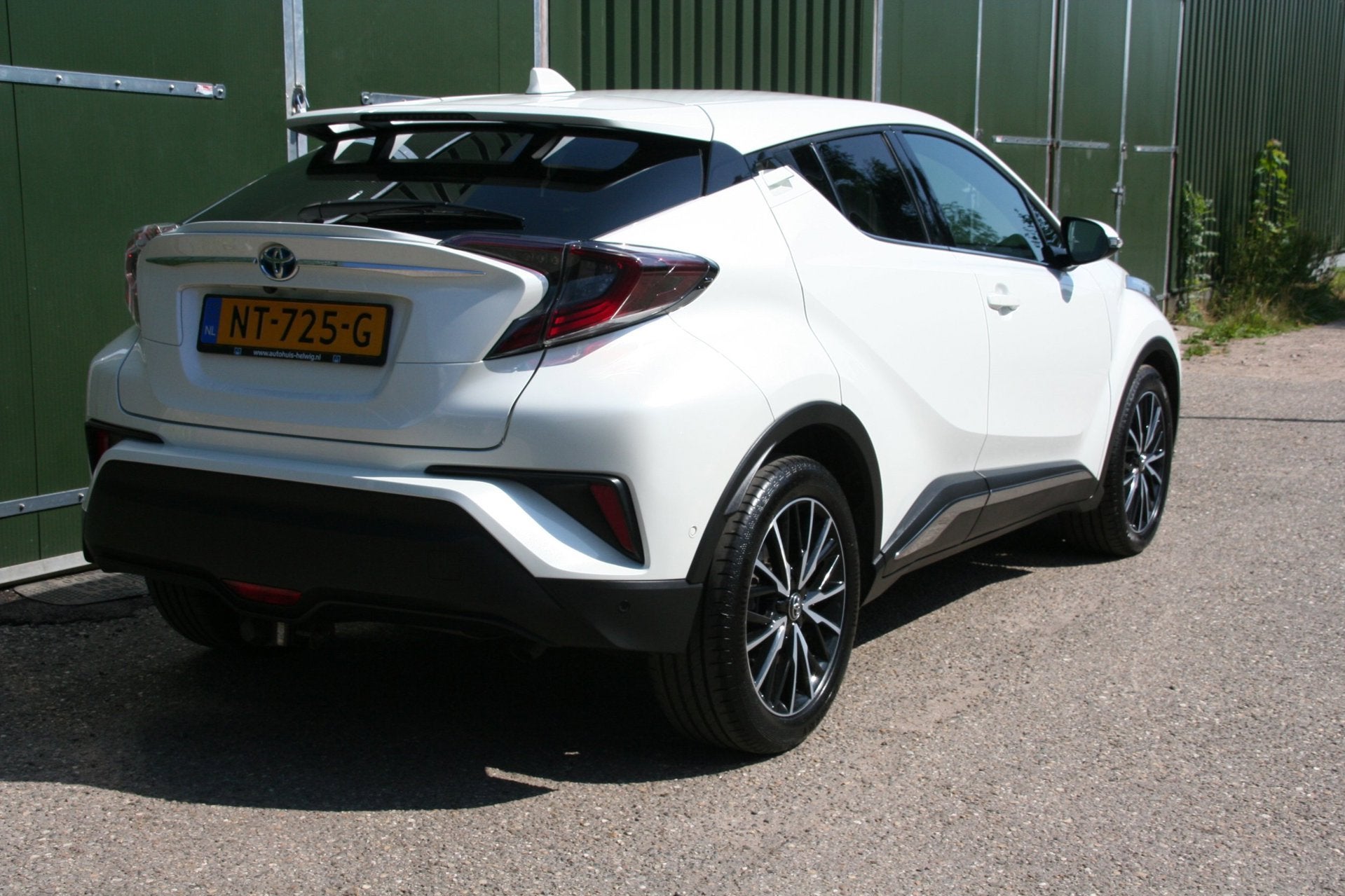 Toyota C-HR 1.8 Hybrid Premium Excecutive, LEER, NAVIGATIE,, Auto's, Dealer onderhouden, 4 cilinders, Leder en Stof, Wit