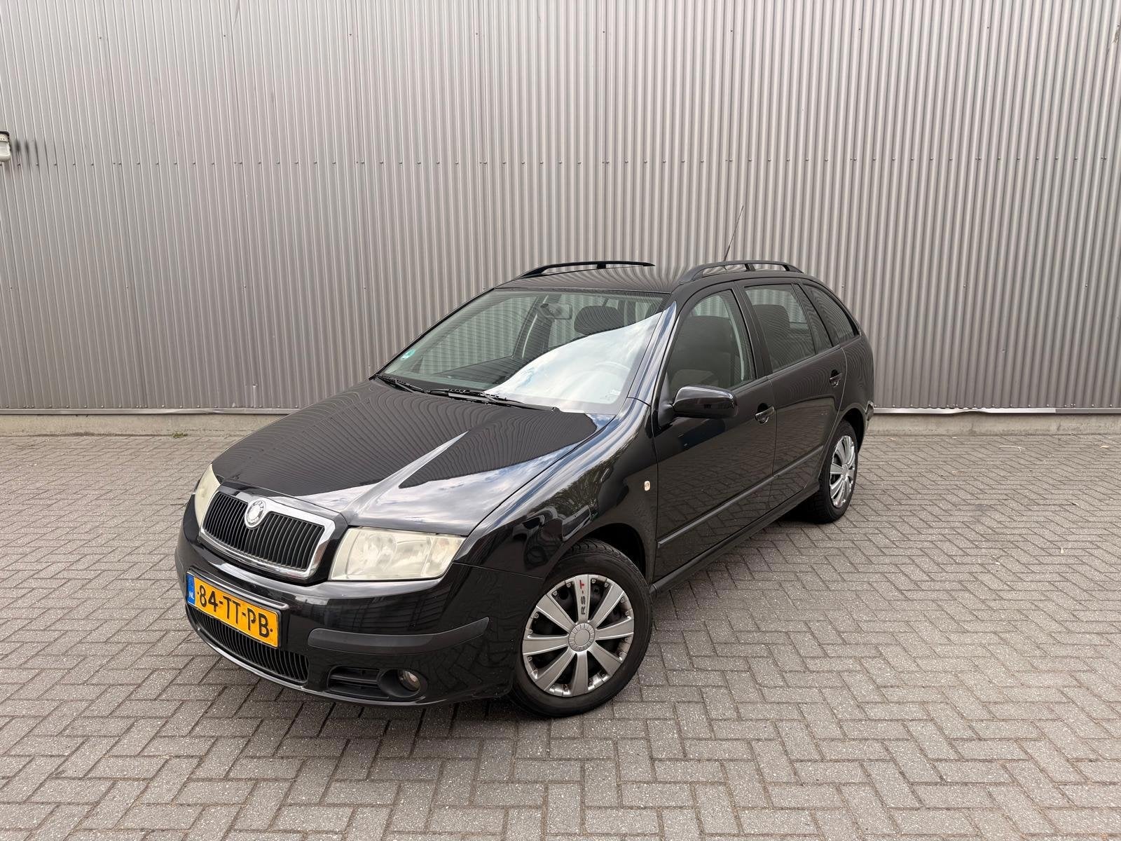 Skoda Fabia Combi 1.4-16V Spirit+ Airco|Cruise control|Elekt, Auto's, Voorwielaandrijving, Gebruikt, Zwart, 4 cilinders