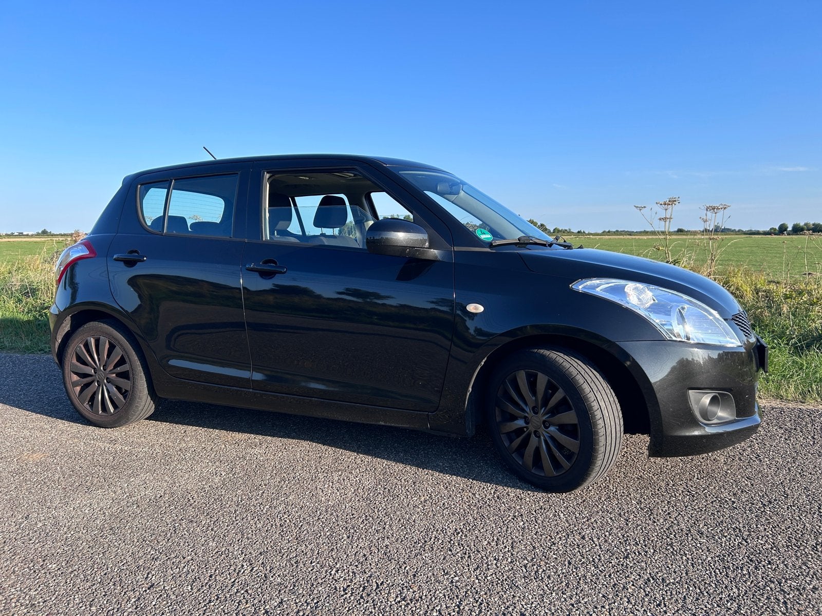Suzuki Swift 1.2 5-D 2012 Zwart, Voorwielaandrijving, Stof, 4 cilinders, 400 kg