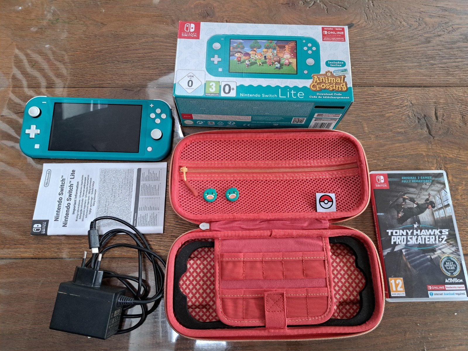 Nintendo Switch Lite Turquoise met games en accessoires, Ophalen, Met games, Zo goed als nieuw, Zonder controller