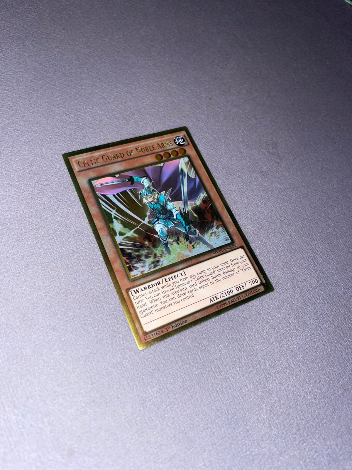 Yu-Gi-Oh! Celtic Guardian of Noble Arms Gold rare mvp1-eng48, Hobby en Vrije tijd, Verzamelkaartspellen | Yu-gi-Oh!, Ophalen of Verzenden