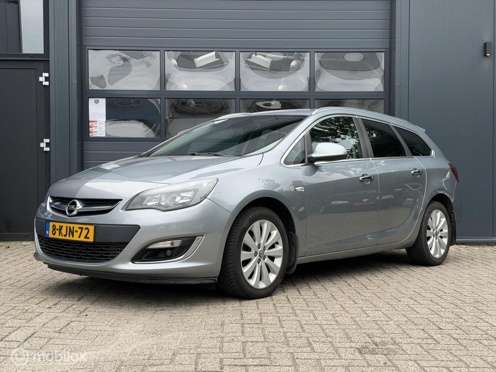 Opel Astra Sports Tourer 1.4 Turbo | Airco | Cruise | Navi, Voorwielaandrijving, Euro 5, Gebruikt, 4 cilinders
