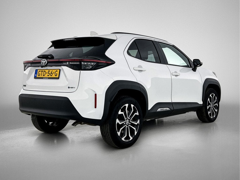 Toyota Yaris Cross 1.5 Hybrid 115 First Edition (bj 2024), Auto's, 12 maanden, Stof, Gebruikt, 116 pk