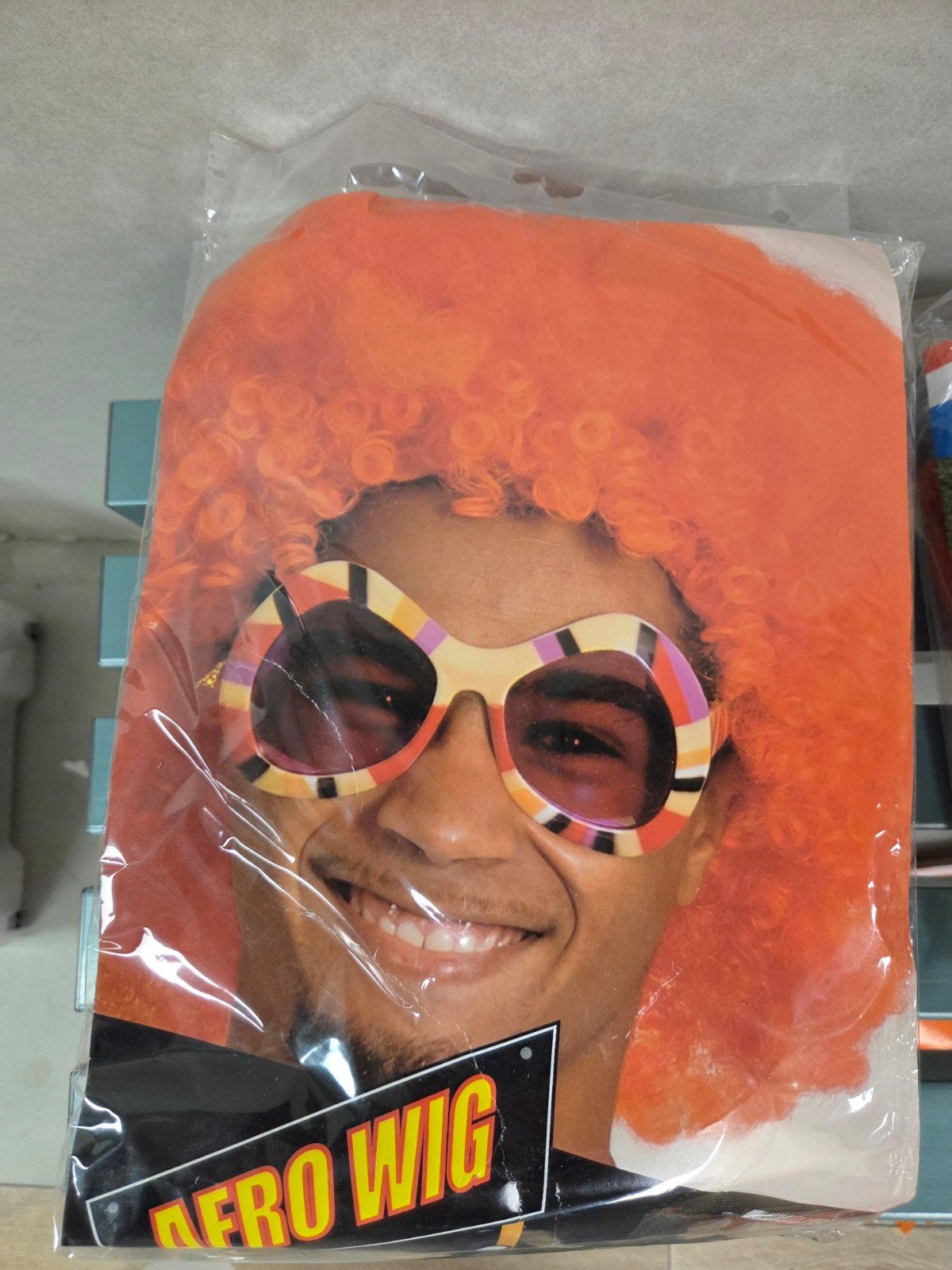 Oranje Afro Pruik - Perfect voor Feestjes en Carnaval, Ophalen of Verzenden, Nieuw, Hoed of Pruik, Carnaval