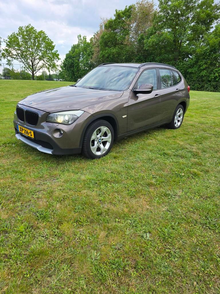 BMW X1 Sdrive 18I AUT 2010 Bruin, Auto's, Achterwielaandrijving, 1995 cc, Beige, 4 cilinders