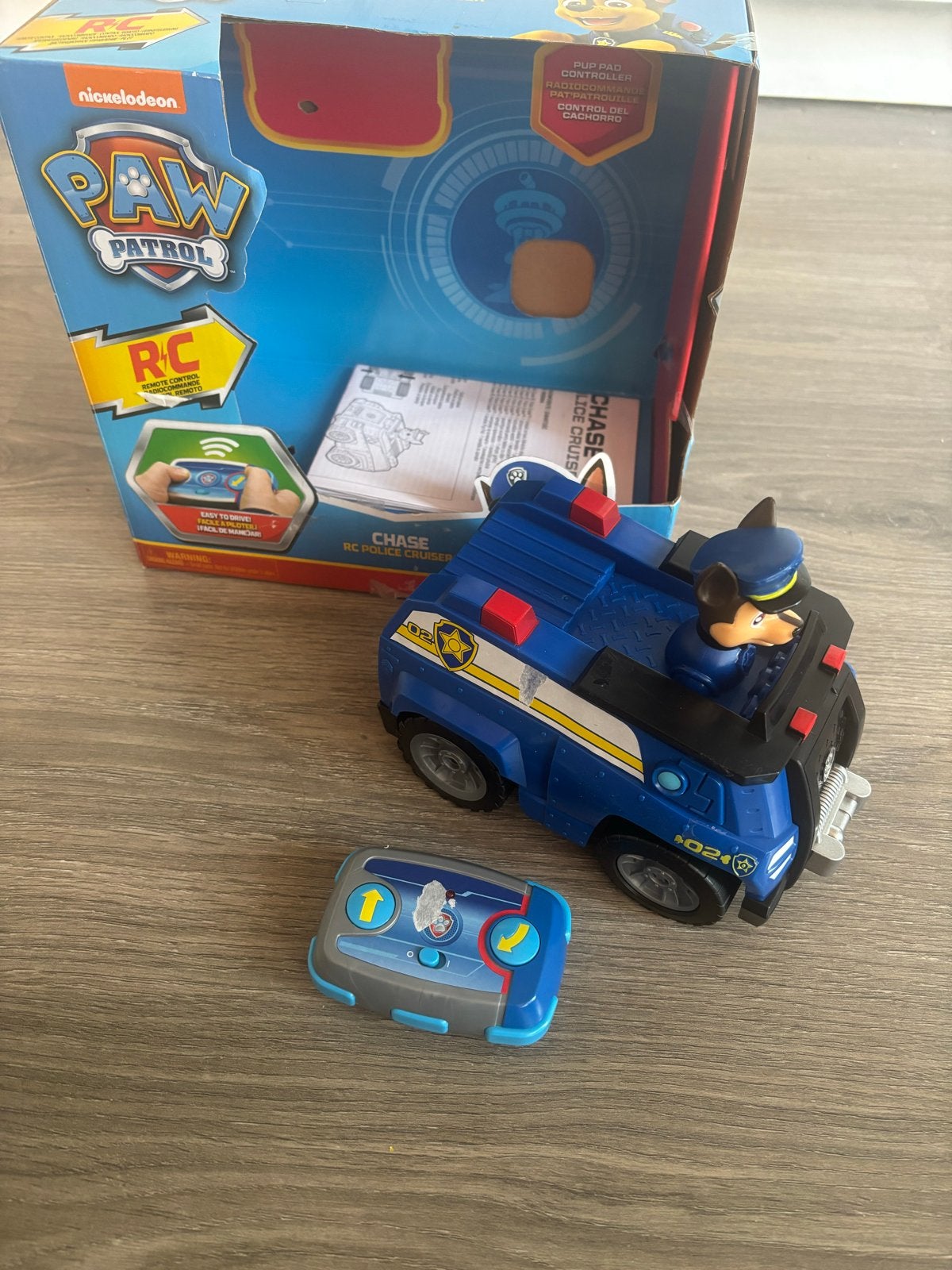 Paw Patrol RC Politie Cruiser Chase - Stickers beschadigd, Ophalen of Verzenden, Zo goed als nieuw, Afstandsbediening