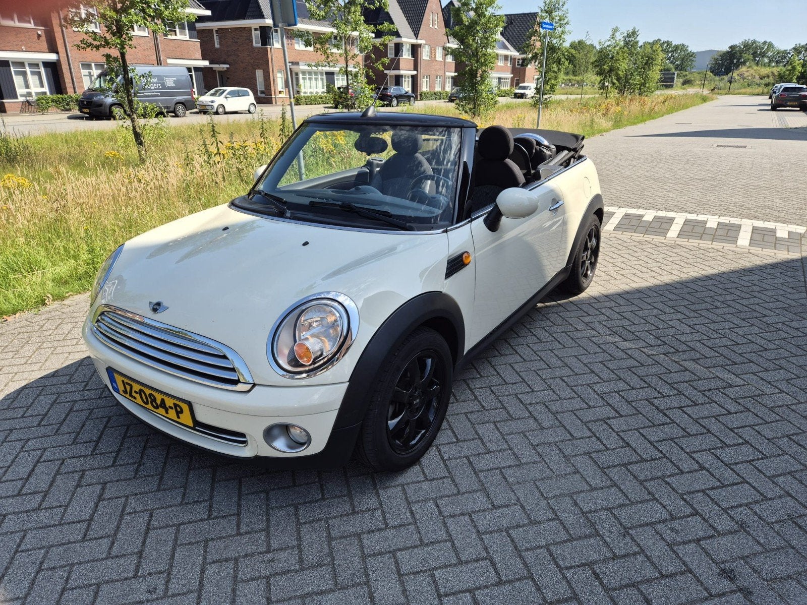 Mini Cabrio 2009  km 162.000, Auto's, Mini, Zwart, Leder en Stof, Beige, Particulier