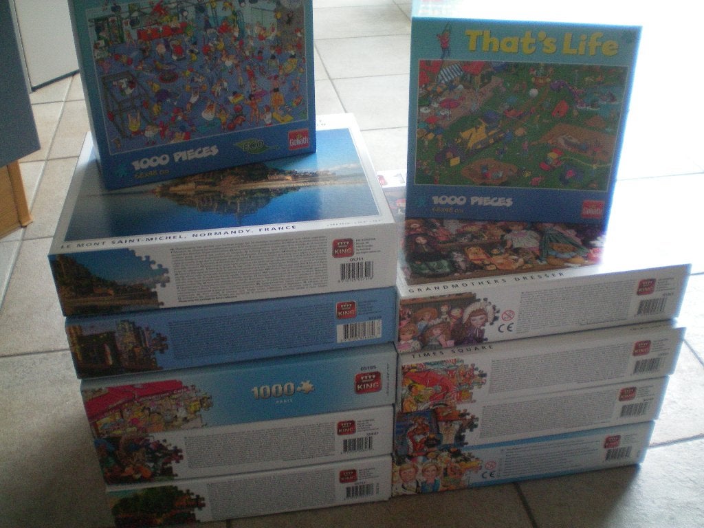 Partij Puzzels van 1000 stukjes. 11 dozen., Ophalen of Verzenden, 500 t/m 1500 stukjes, Zo goed als nieuw, Legpuzzel