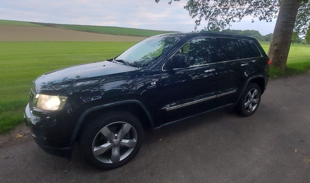 Jeep Grand Cherokee 3.6 Overland 2011 Zwart Panoramadak, Auto's, Automaat, Navigatiesysteem, Zwart, Vierwielaandrijving