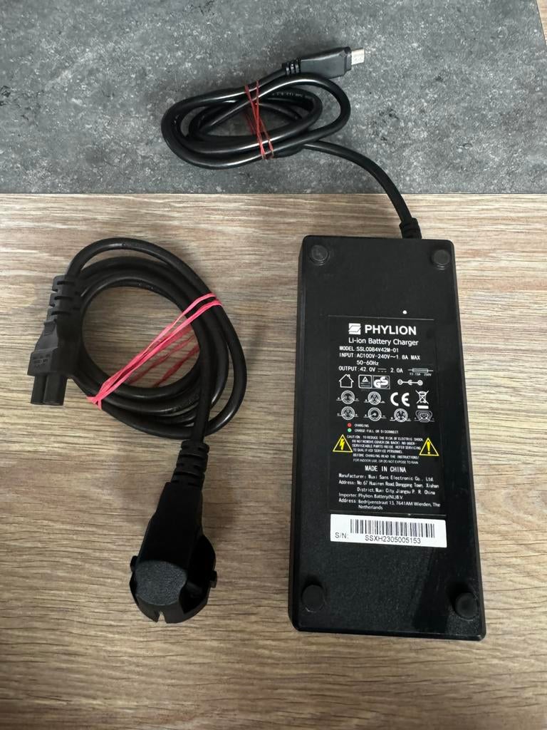 Phylion battery charger, Stella fiets accu lader, Fietsen en Brommers, Fietsaccessoires | Fietsaccu's, Ophalen of Verzenden, Zo goed als nieuw