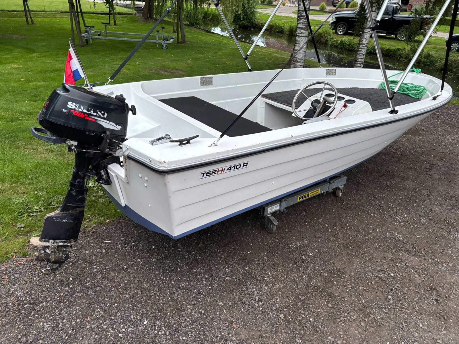 Terhi 410 bootje met stuur en 6 pk Suzuki 4 takt, Overige merken, Gebruikt, Buitenboordmotor, Biminitop